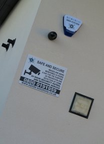 Image of security alarm and CCTV sign